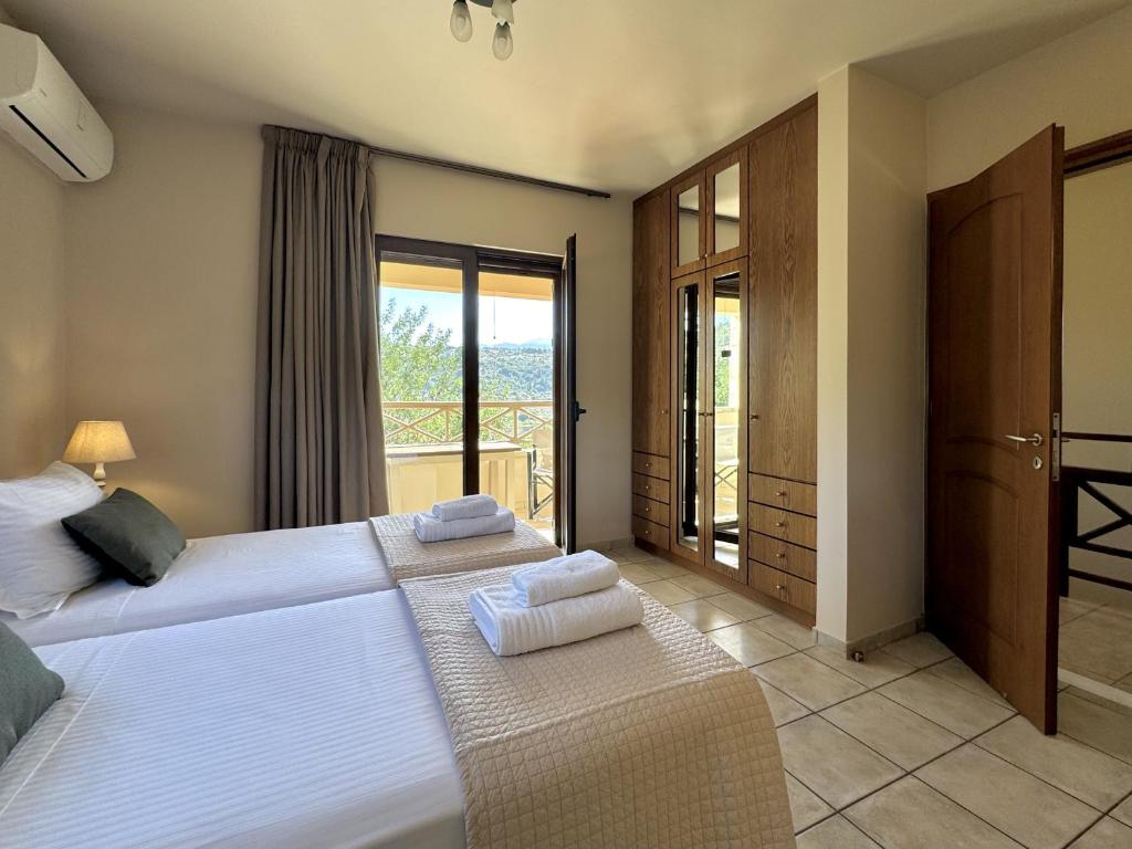 Postel nebo postele na pokoji v ubytování Villa Metapothia Gavalochori Crete