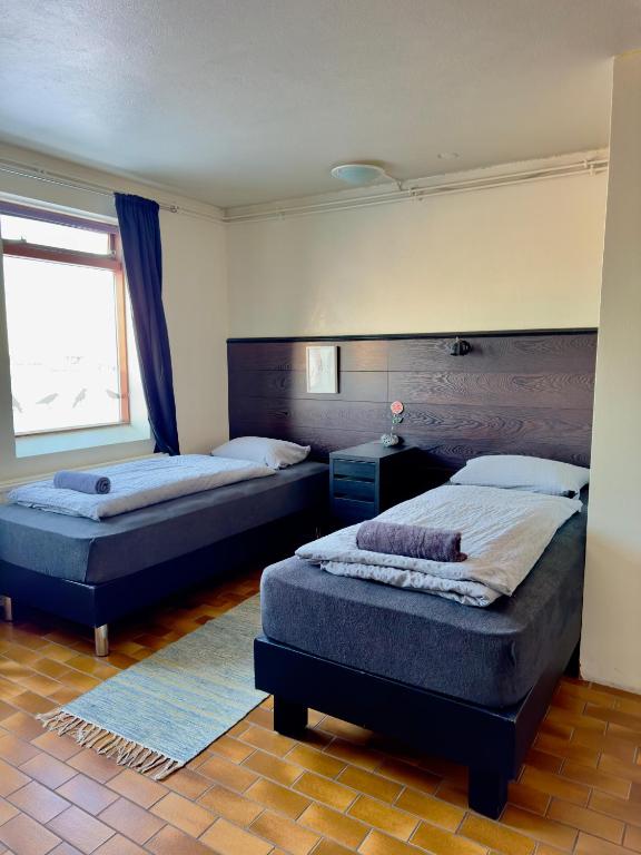 Voodi või voodid majutusasutuse Fisherinn Guesthouse toas