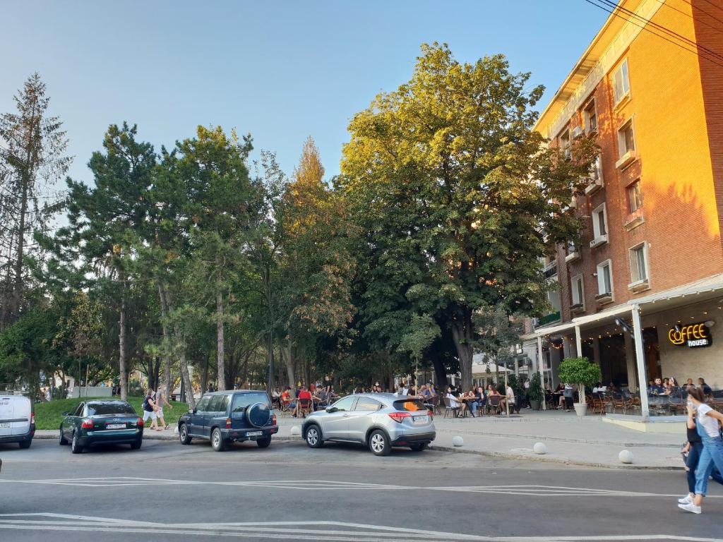 a street with cars parked on the side of the road at CERONAV CityCenter - DisneyTV!! in Galaţi