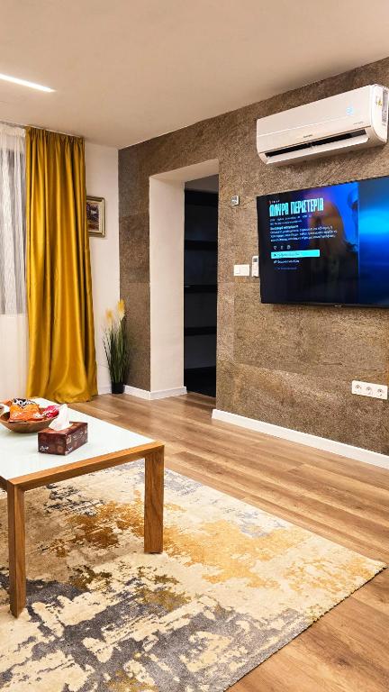 TV a/nebo společenská místnost v ubytování Morava 1 Asparuhovo Beach Holiday Home Apatment
