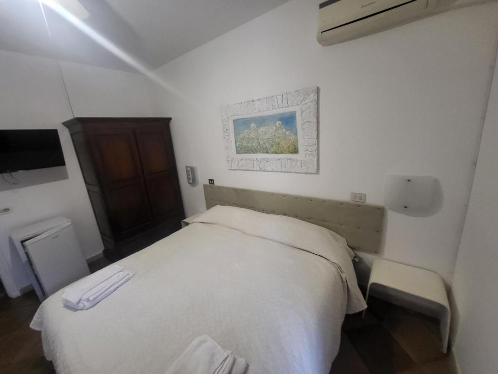 Postel nebo postele na pokoji v ubytování Hotel Dory