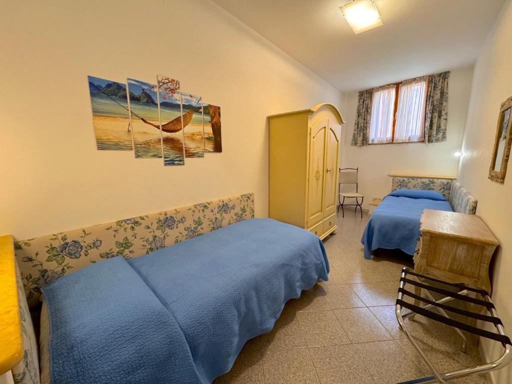 Postel nebo postele na pokoji v ubytování Magralù 2 B&B