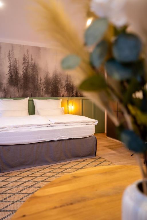 Postel nebo postele na pokoji v ubytování Hirschenhof Apartments