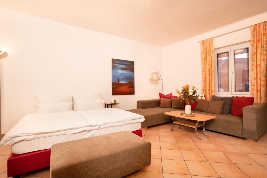 Postel nebo postele na pokoji v ubytování Hirschenhof Apartments