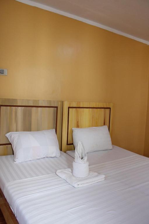 Postel nebo postele na pokoji v ubytování Agustin El Nido Inn