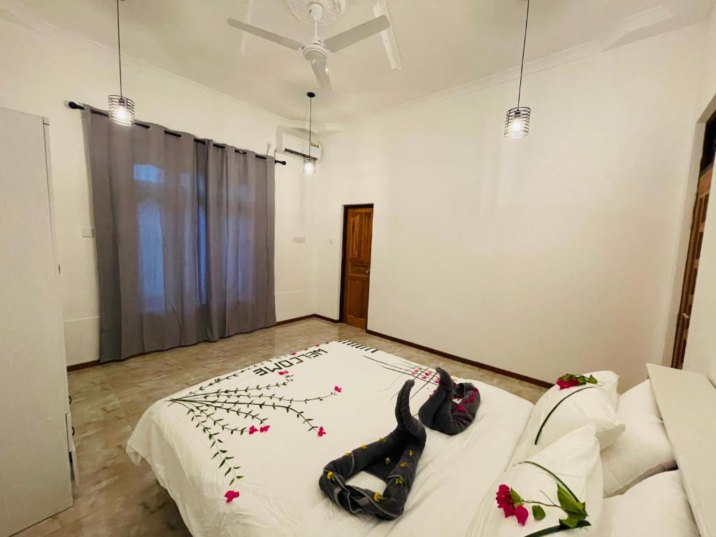 Postel nebo postele na pokoji v ubytování White Tern Maldives