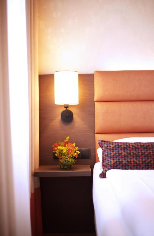 Llit o llits en una habitació de Drei Kronen Hotel Wien City