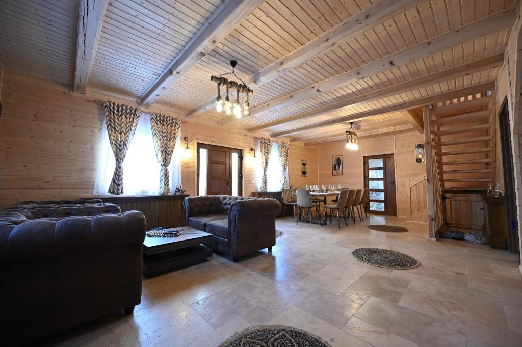 a large living room with couches and a table at Casa Pop in Râşnov
