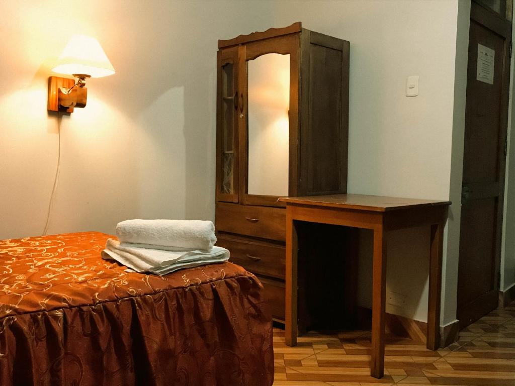 Postel nebo postele na pokoji v ubytování Nafis Casona Apu Linli Pisac