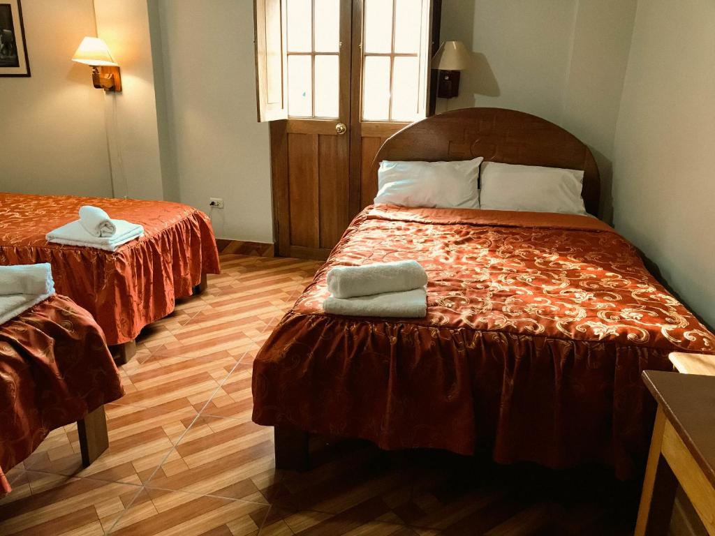 Postel nebo postele na pokoji v ubytování Nafis Casona Apu Linli Pisac