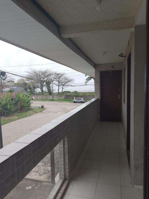a hallway of a building with a view of a street at Flat super top in Guaratuba