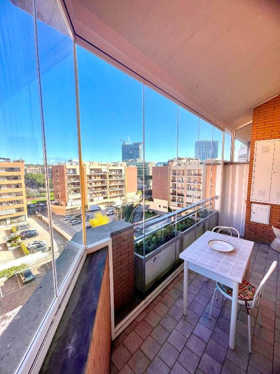 a balcony with a table and a view of a city at Vacanze Romane LB&C in Rome