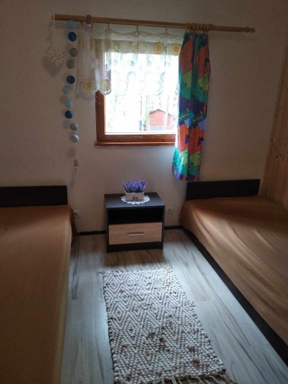 Posteľ alebo postele v izbe v ubytovaní Oleandria-,, Domek Poziomeczka" nr 33 -ogrzewany w okresie jesienno-zimowym