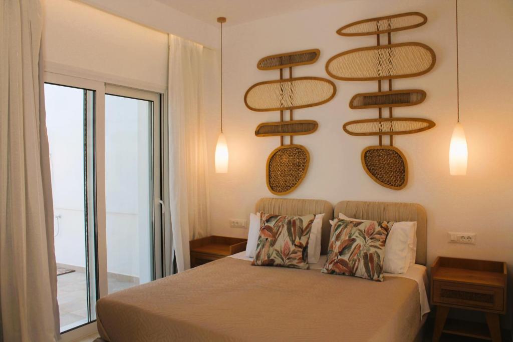 Postel nebo postele na pokoji v ubytování Akropolis Village Complex of Luxury Residence