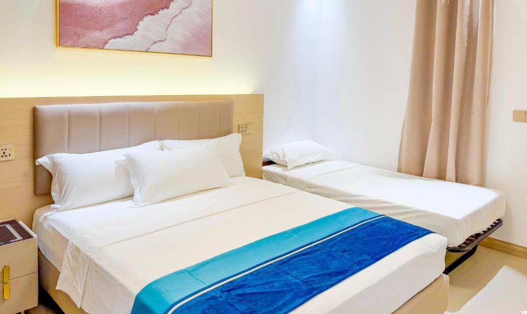 Postel nebo postele na pokoji v ubytování Aqua Heaven Inn