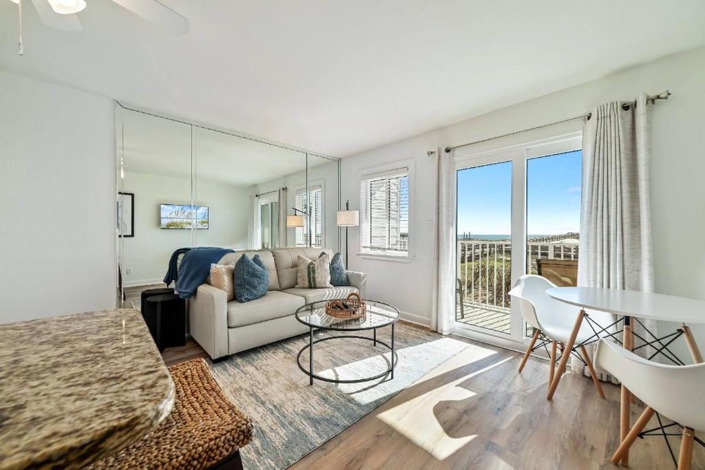 a living room with a couch and a table at Gulf Shores Plantation East 2102 in Gulf Highlands