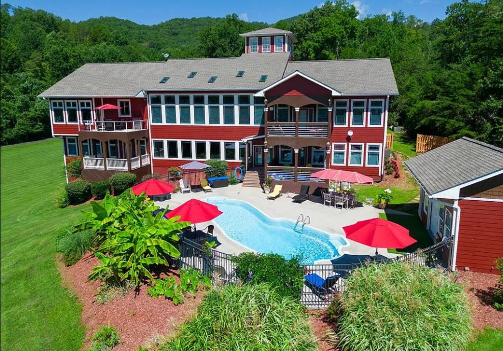an aerial view of a large house with a swimming pool at Deep Creek Manor in Bryson City
