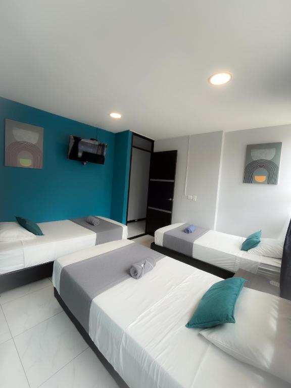 Postel nebo postele na pokoji v ubytování Hotel HILLS BOGOTA