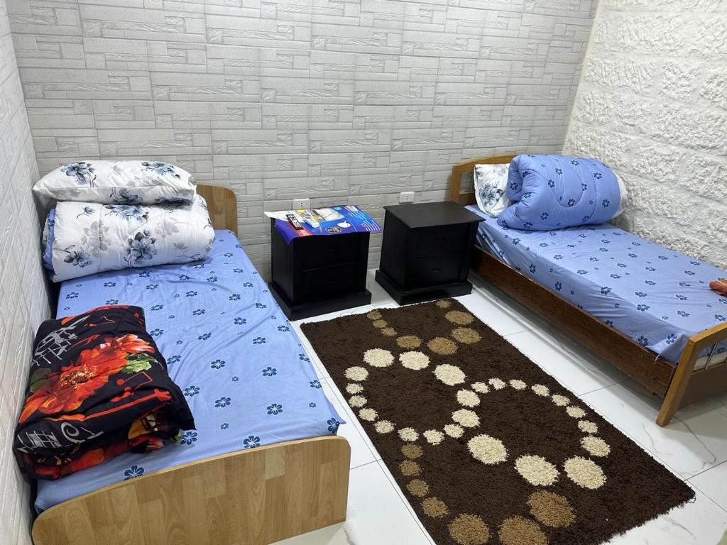 عمان tesisinde bir odada yatak veya yataklar