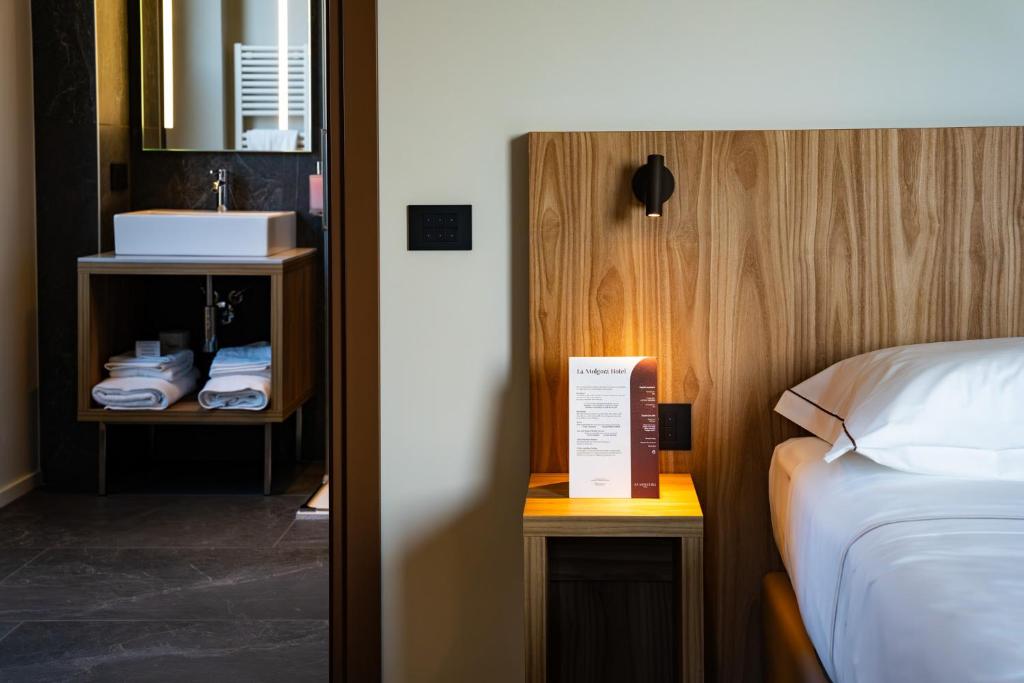 Postel nebo postele na pokoji v ubytování La Molgora Hotel