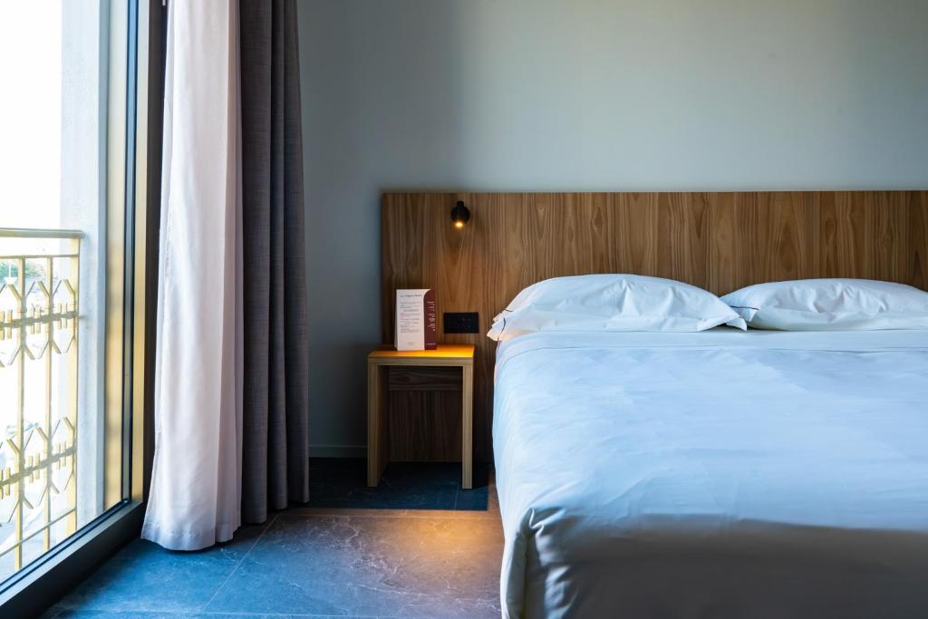 Postel nebo postele na pokoji v ubytování La Molgora Hotel