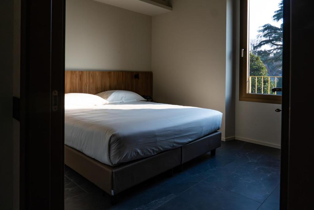 Postel nebo postele na pokoji v ubytování La Molgora Hotel