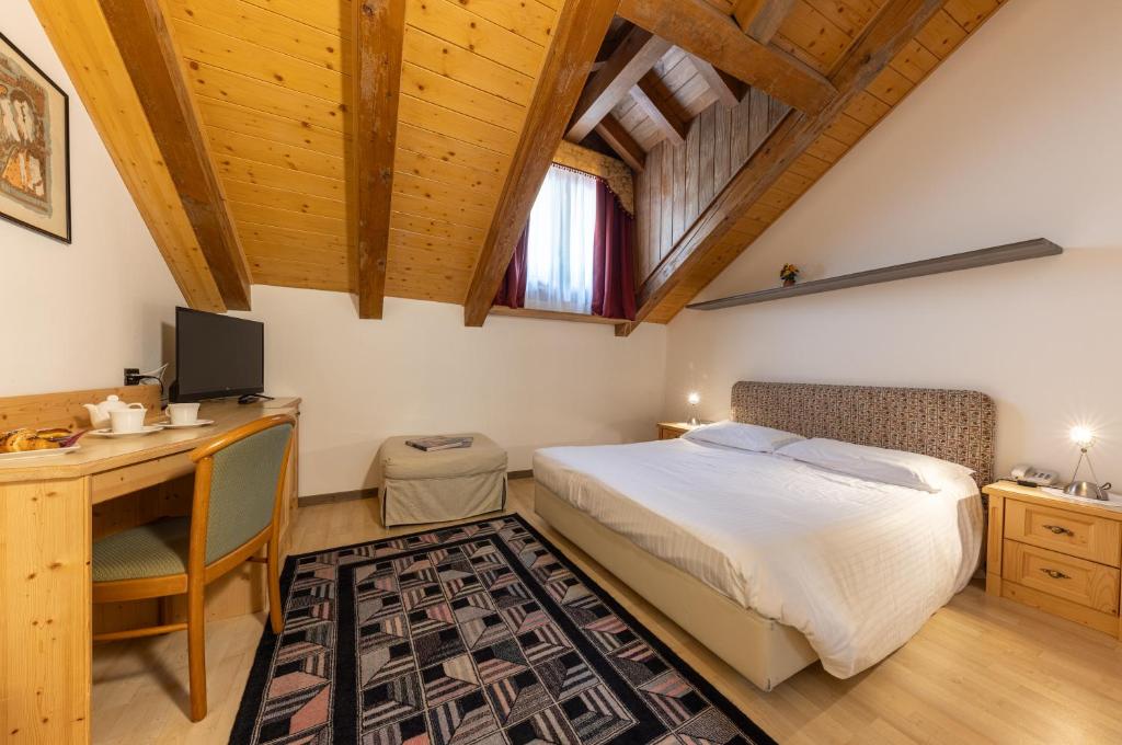 Postel nebo postele na pokoji v ubytování Hotel Plank