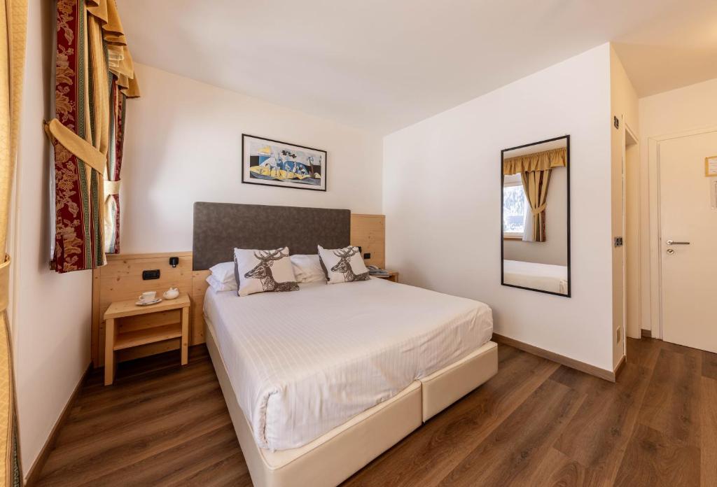 Postel nebo postele na pokoji v ubytování Hotel Plank