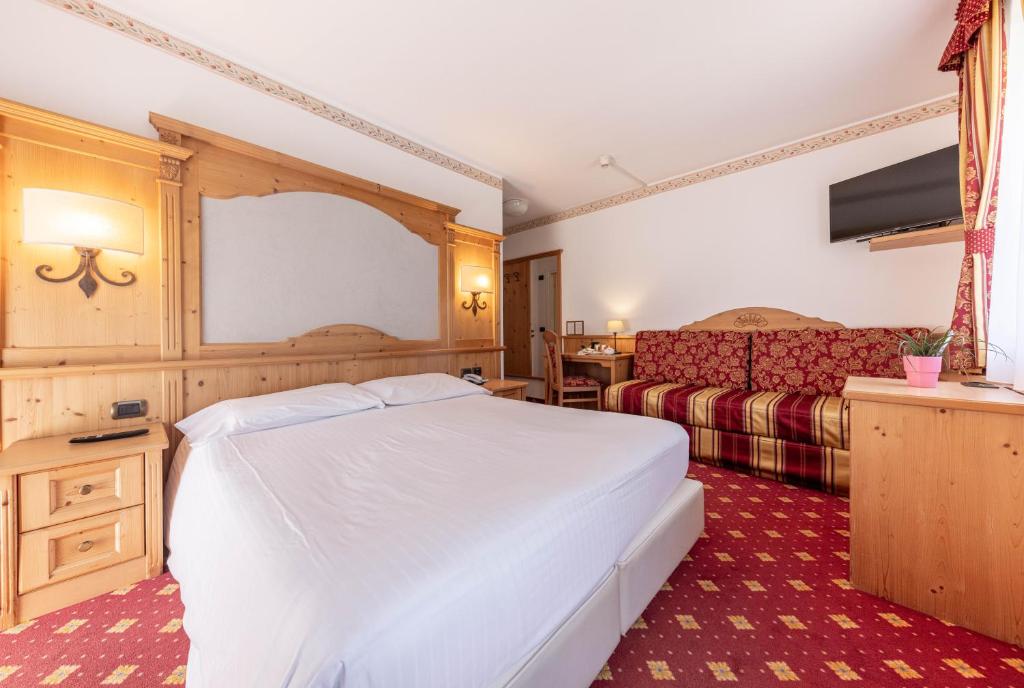 Postel nebo postele na pokoji v ubytování Hotel Plank