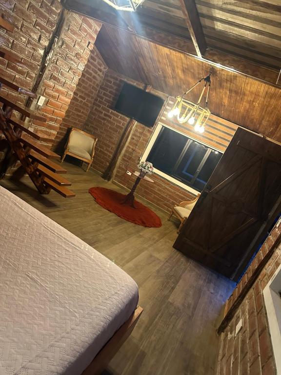 Postel nebo postele na pokoji v ubytování Cabañas El Guayabillo - Baños de agua Santa