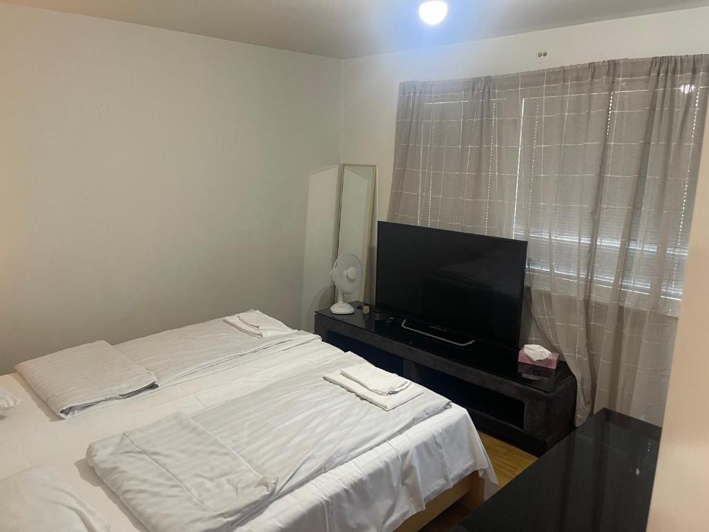 Postel nebo postele na pokoji v ubytování Studio