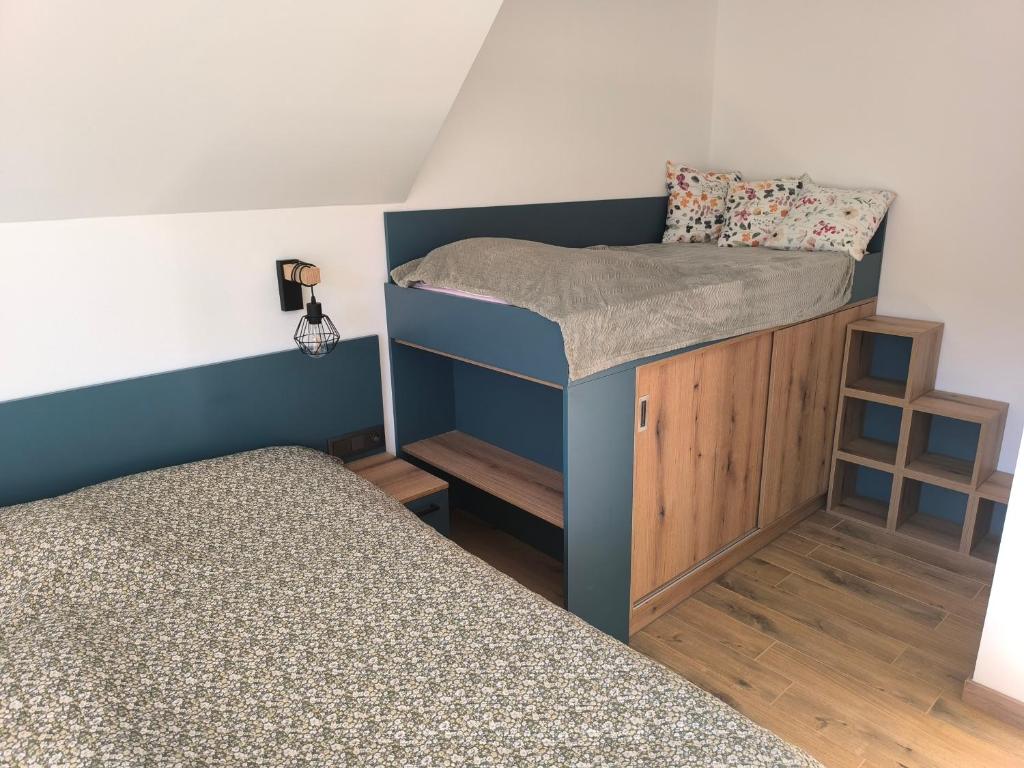 Postel nebo postele na pokoji v ubytování Horský apartmán Stříbrnice