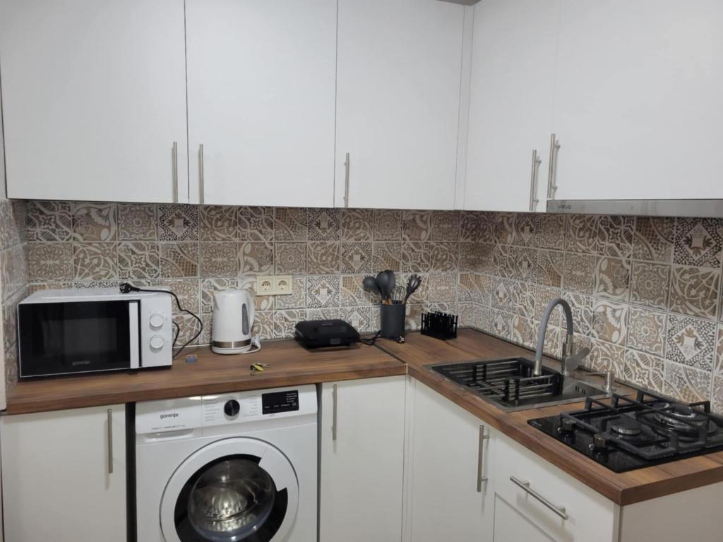 Kuchyň nebo kuchyňský kout v ubytování Apartment Oxalis
