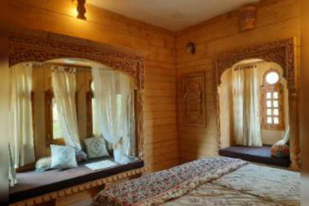 Postel nebo postele na pokoji v ubytování Hotel Janat Heritage