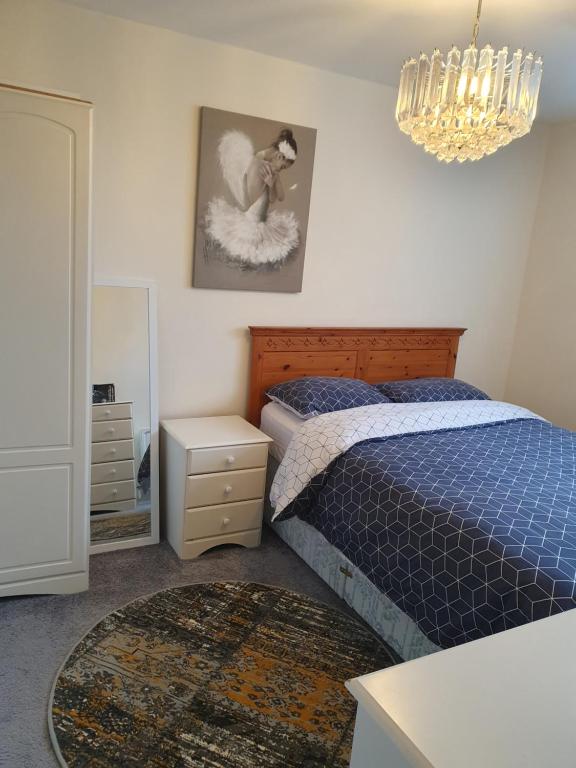Ένα ή περισσότερα κρεβάτια σε δωμάτιο στο Cosy Apartment
