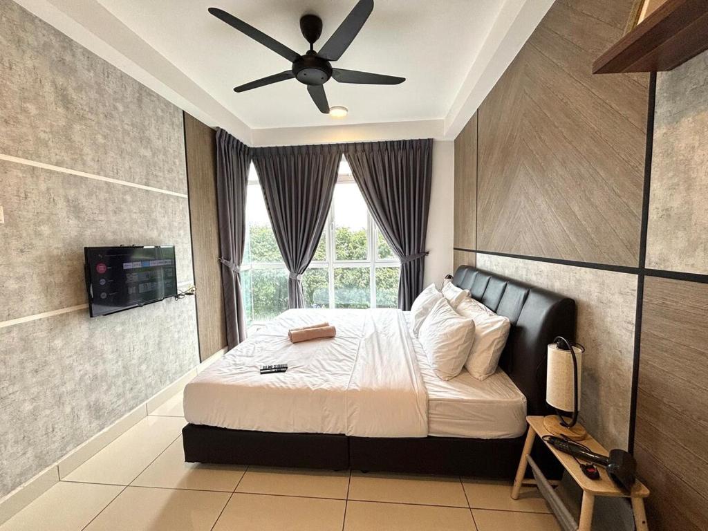 a bedroom with a bed with a ceiling fan at KSL Premium-Style 3R3B 1-5Pax #Daya#Austin#Ikea in Johor Bahru