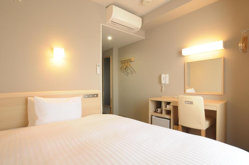 Letto o letti in una camera di AB Hotel Tahara