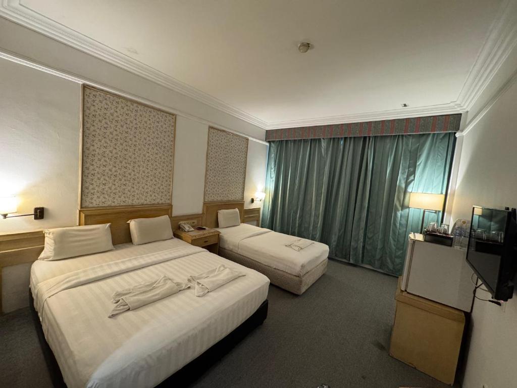 Postel nebo postele na pokoji v ubytování Hotel Deleeton