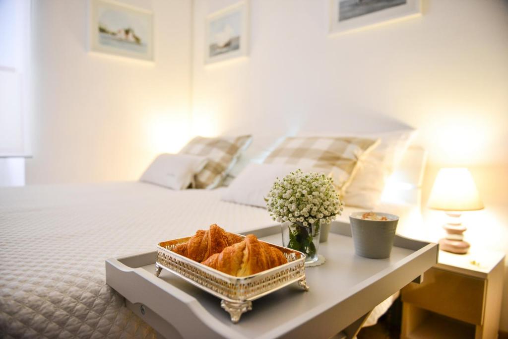 Posteľ alebo postele v izbe v ubytovaní Central Palace Apartment