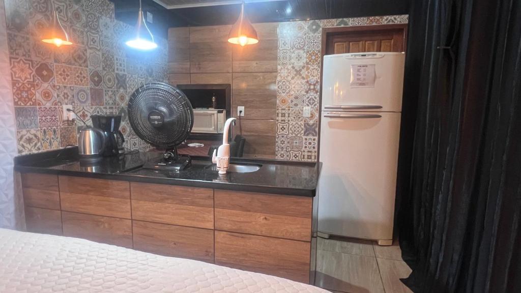 Köök või kööginurk majutusasutuses Quarto Aconchegante N 1