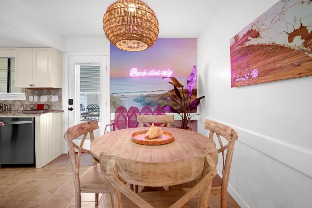 a kitchen and dining room with a table and chairs at Sandcastles and Sunshine - Gulf Highlands Beach Resort in Panama City Beach