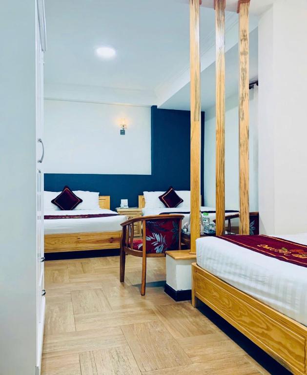 Giường trong phòng chung tại Dalat ECO Hotel 2