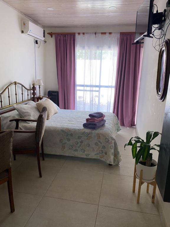 Ένα ή περισσότερα κρεβάτια σε δωμάτιο στο Brisa