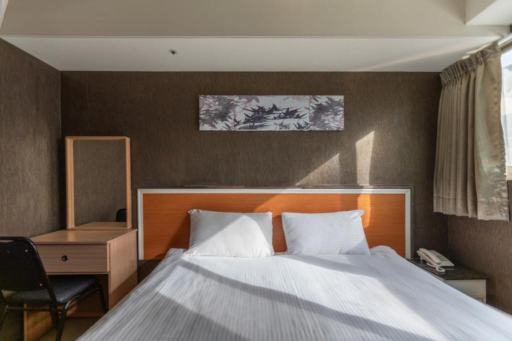 Postel nebo postele na pokoji v ubytování E Lim Hotel