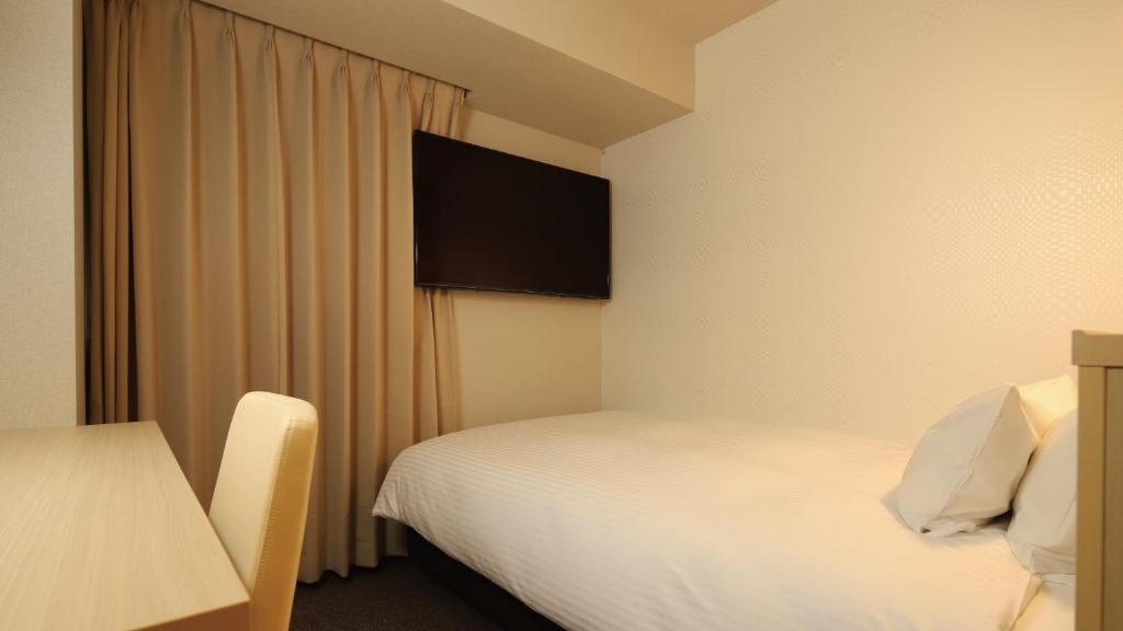 Postel nebo postele na pokoji v ubytování AB Hotel Shiojiri