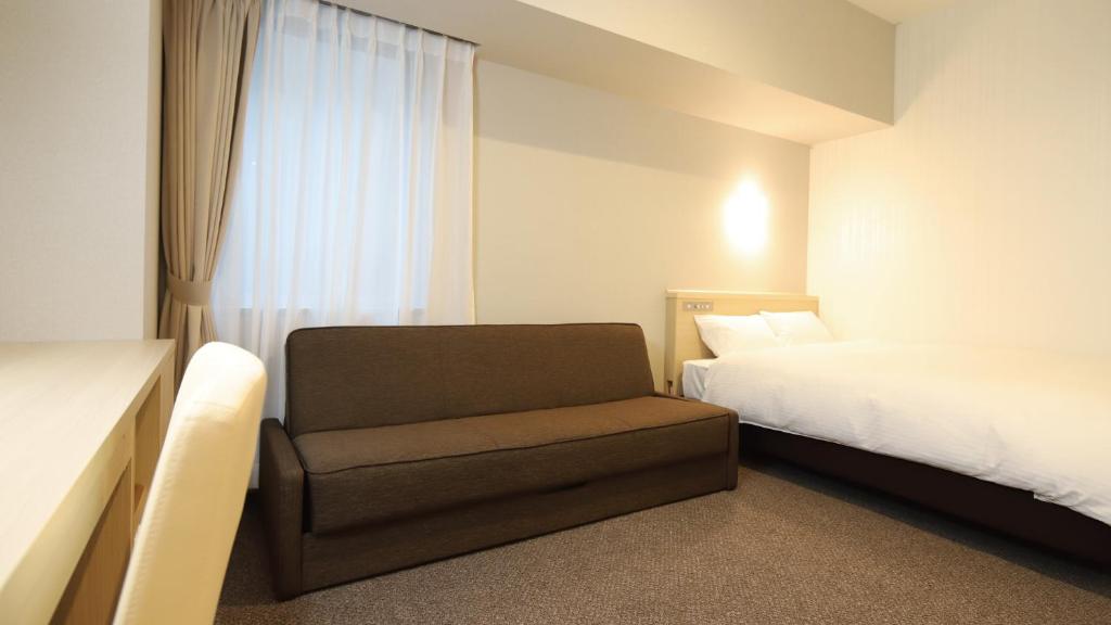 Postel nebo postele na pokoji v ubytování AB Hotel Shiojiri