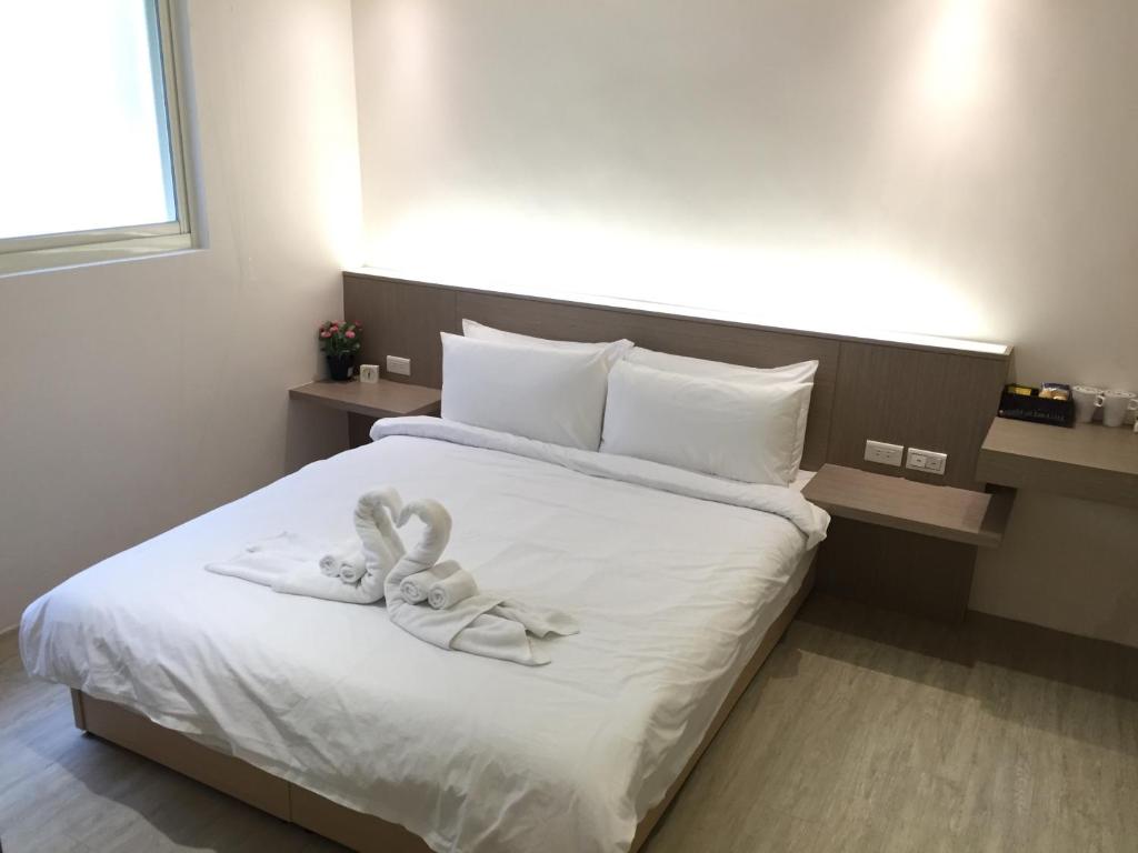 Postel nebo postele na pokoji v ubytování 幸福圓點新北市民宿220號