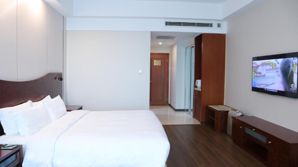 TV a/nebo společenská místnost v ubytování Shanghai Metropark Jichen Hotel