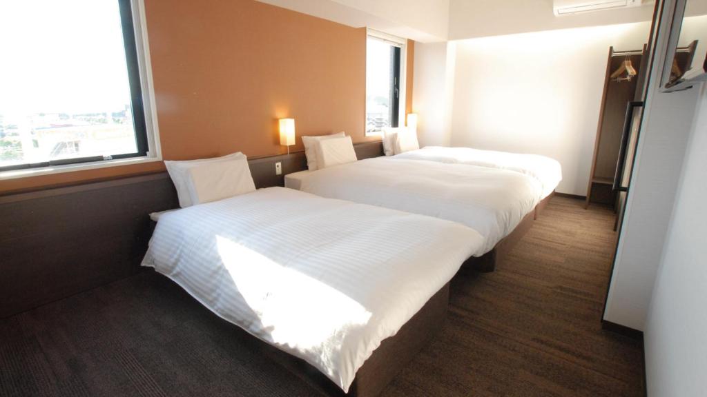 Letto o letti in una camera di AB Hotel Kakamigahara