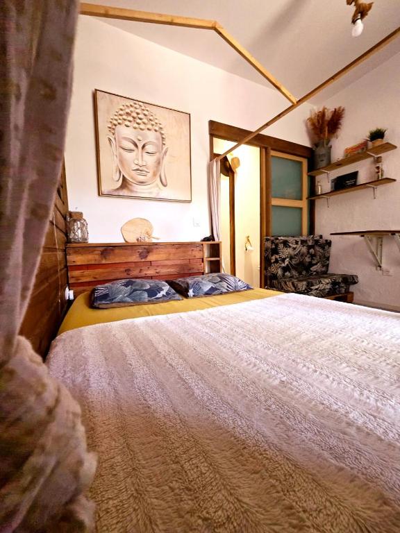 Postel nebo postele na pokoji v ubytování Au geko bleu